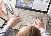 top view of person typing on a laptop