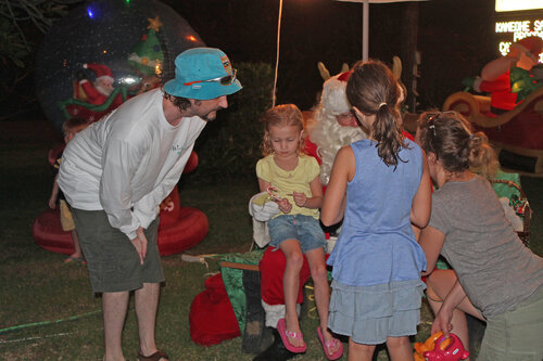 children greeting santa clause