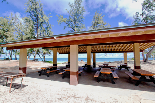 a picnic area with benches and a covered area<br />
