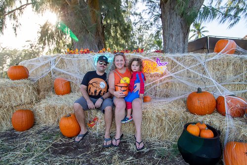 a picture of a family during Halloween 