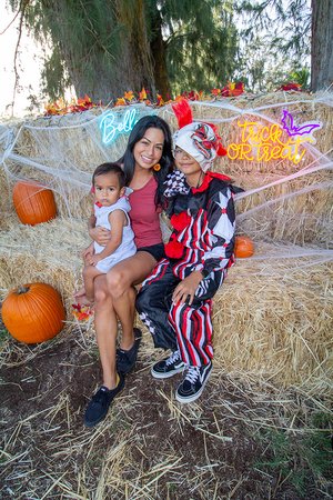 family taking a picture on Halloween 