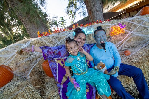 a group of people posing for a picture during Halloween 