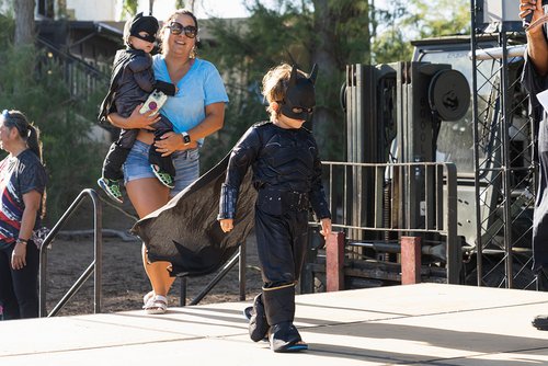 a person holding a child and a child wearing a garment