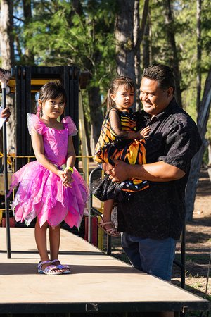 a person holding two childs