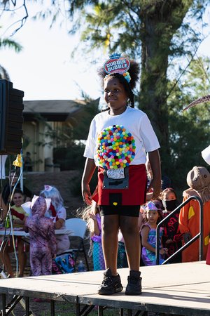 a child holding a bubble gum ball