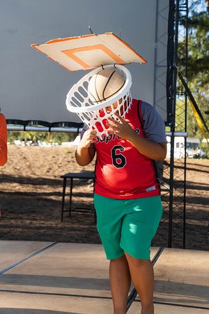 a person holding a basket over their head