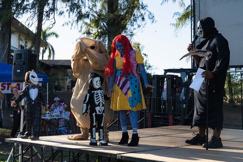 a group of people in clothing on a stage<br />
