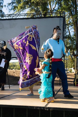 a person and a child on a stage<br />
