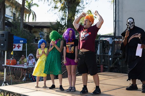 group of people in garments on stage