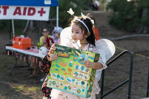 a child in garment holding a box