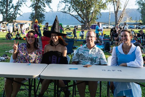 a group of people sitting at tables<br />
