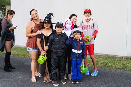 a group of people in garment posing for a photo 