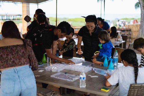 a group of people at a table<br />
