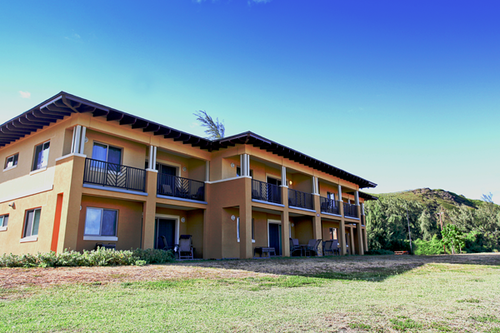 a building with a lawn and grass