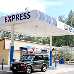 a car parked under a gas station