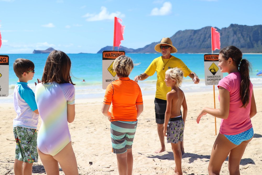 a group of people on a beach