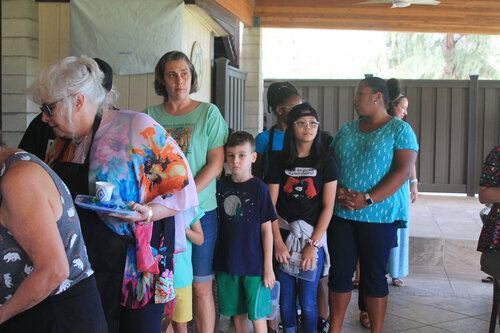 a group of people standing in a line