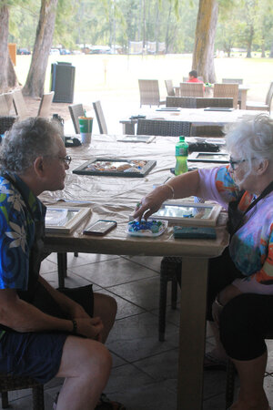 a person and person sitting at a table