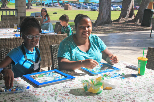 a person and a child sitting at a table