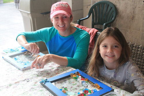 a person and a child sitting at a table