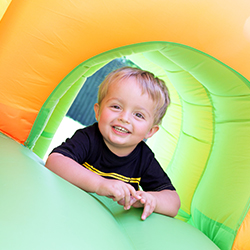 a boy sitting on inflatable