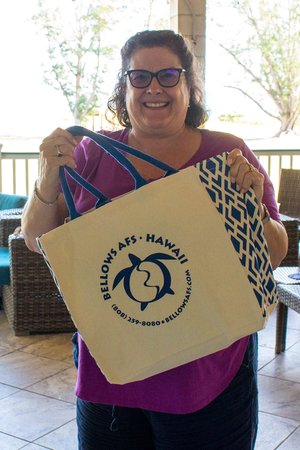 a woman holding a paper bag