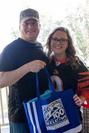 man and woman holding a bag