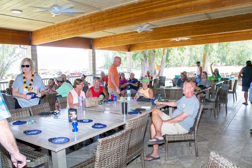 a group of people sitting around a table