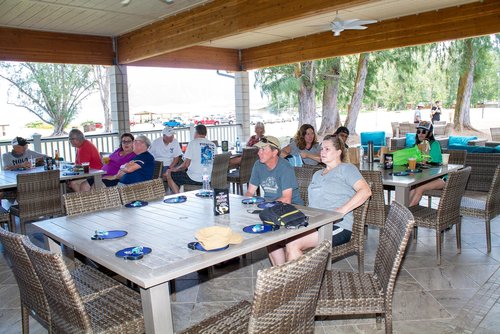 a group of people sitting around a table