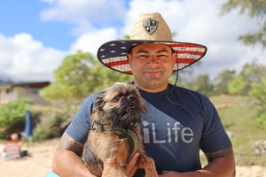 a man holding his dog