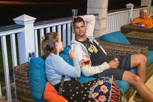 a man and a woman sitting on the couch 