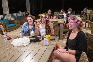 a group of people sitting around the table 