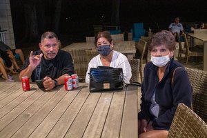 a group of people sitting around the table