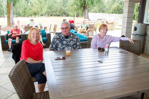 a group of people sitting at a table<br />
