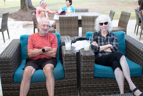 man and woman sitting in a couch