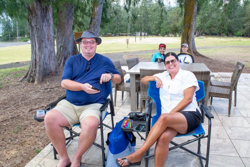 man and woman sitting on a chair