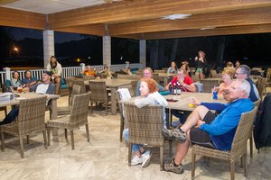 a group of people sitting at tables<br />
