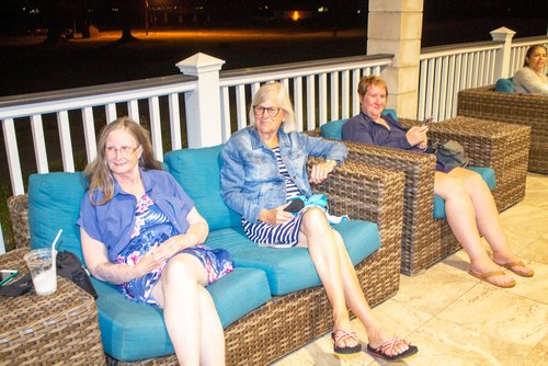 group of people sitting on a couch 