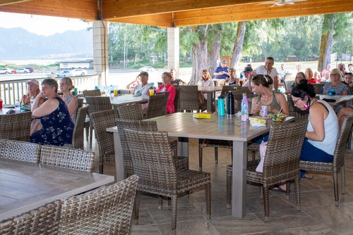 a patio with tables and chairs