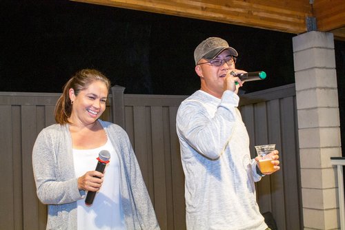 man and woman singing