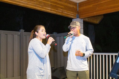 man and woman singing