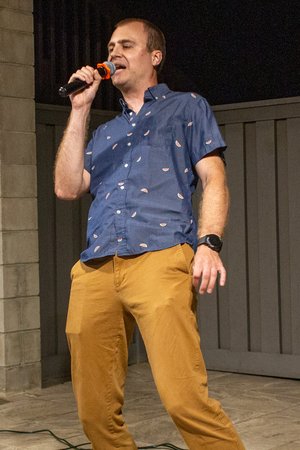 a man singing into a microphone