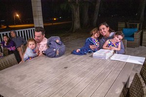 a group of people sitting on a table<br />
