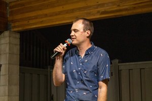 a man singing into a microphone