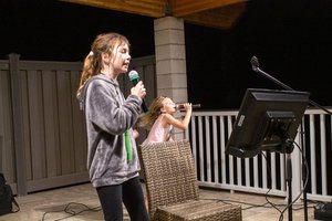 kids singing into a microphone