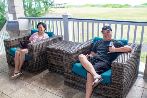 man and woman sitting on a couch