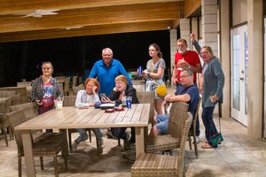 group of people sitting into the table 