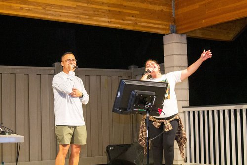 men singing on a microphone