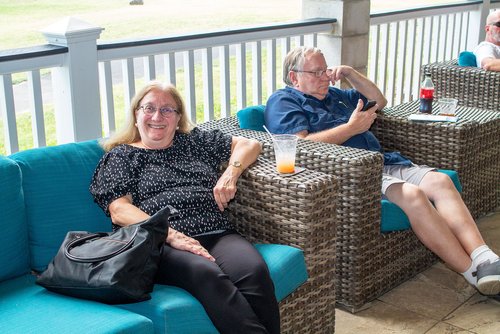 man and woman sitting on the couch 