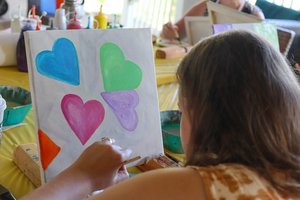 a person painting on a table<br />
